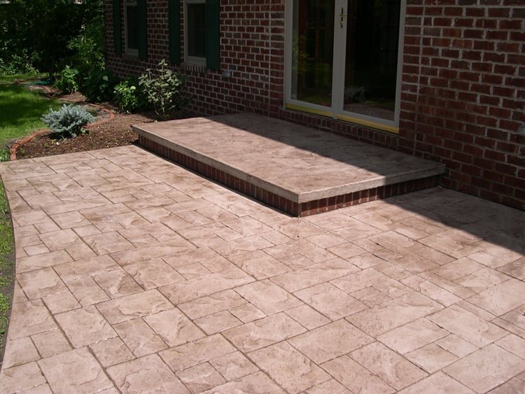 Stamped concrete paver patio and brick step installation by Kodiak Construction in Martinez, CA.